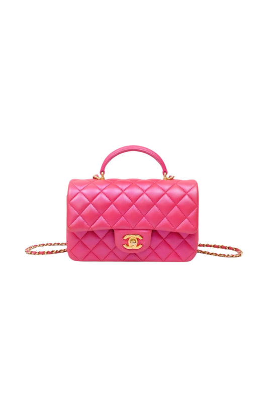Chanel Top Handle Mini Rectangular Flap Bag en cuero Lambskin Dark Pink iridiscente con herrajes Aged Gold.